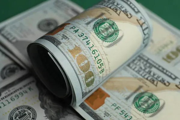 Money exchange. Dollar banknotes on table, closeup