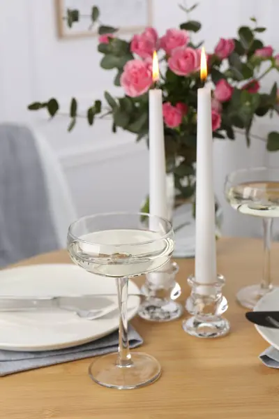 Romantic table setting with candles and flowers