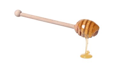 Beyaz arka planda doğal bal damlıyor.