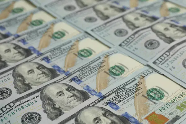 Money exchange. Dollar banknotes as background, closeup