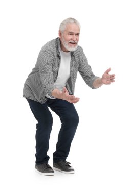 Üst düzey biri beyaz arka planda birini selamlıyor.