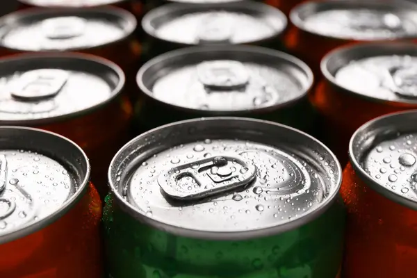 Energy drink in wet cans, closeup. Functional beverage