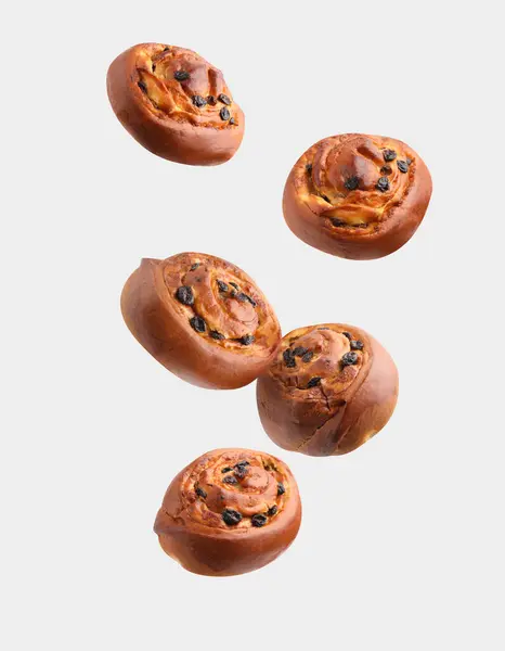 Sweet Buns Delicious Rolls Raisins Falling Light Grey Background — Stock Photo, Image