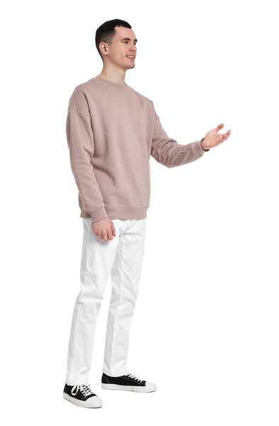 Full length portrait of handsome young man on white background