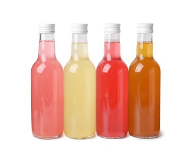 Delicious kombucha in glass bottles isolated on white clipart