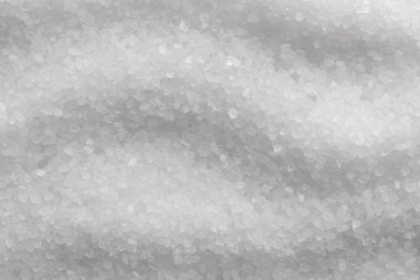 White natural salt as background, top view clipart