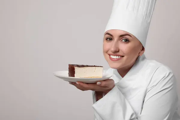 Happy Professional Confectioner Uniform Holding Delicious Cheesecake Light Grey Background Royalty Free Stock Photos