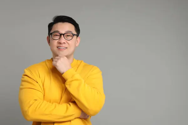 stock image Portrait of happy man on grey background. Space for text