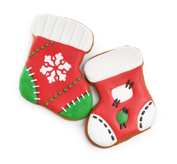 Delicious cookies in shape of Christmas stockings isolated on white, top view