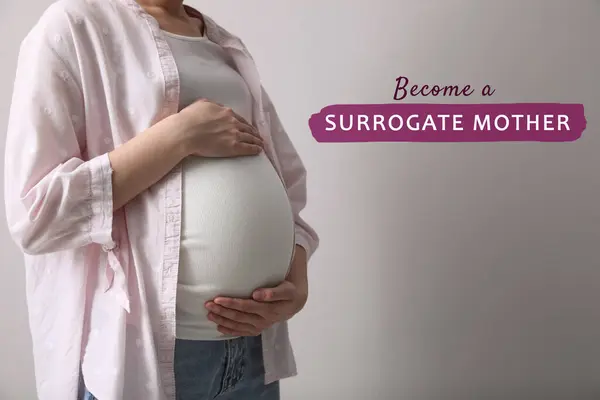 Madre Subrogada Mujer Embarazada Tocando Vientre Sobre Fondo Claro Primer —  Fotos de Stock