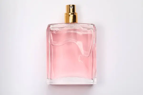 粉红女士香水 白色底色瓶装 顶视图 — 图库照片