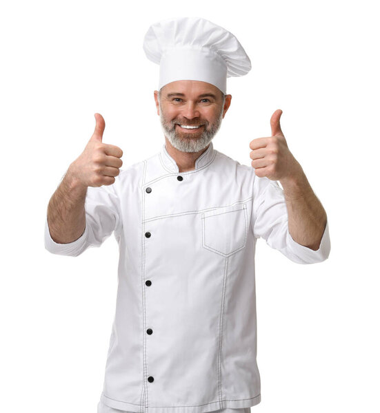 Happy chef in uniform showing thumbs up on white background