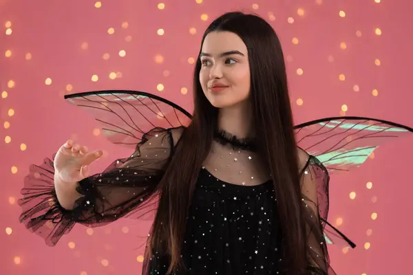 stock image Beautiful girl in fairy costume with wings on pink background