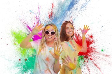 Holi festival celebration. Happy women covered with colorful powder dyes on white background clipart