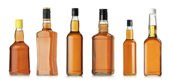 Many bottles of whiskey isolated on white, set