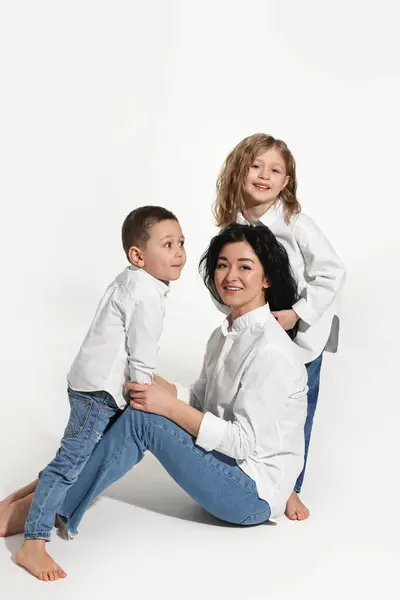 stock image Little children with their mother on white background