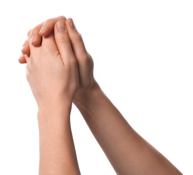 Din. Beyaz arka planda dua eden Hristiyan kadın, yakın plan