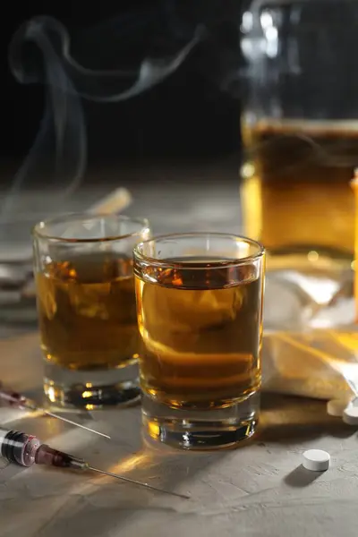 Alcohol Drug Addiction Whiskey Glasses Syringes Pills Grey Background — Stock Photo, Image