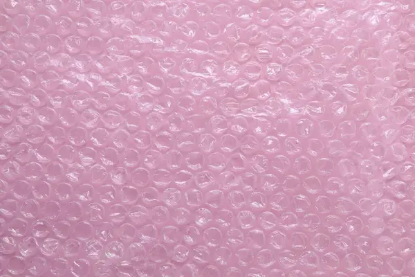 Transparent Bubble Wrap Pink Background Top View — Stock Photo, Image