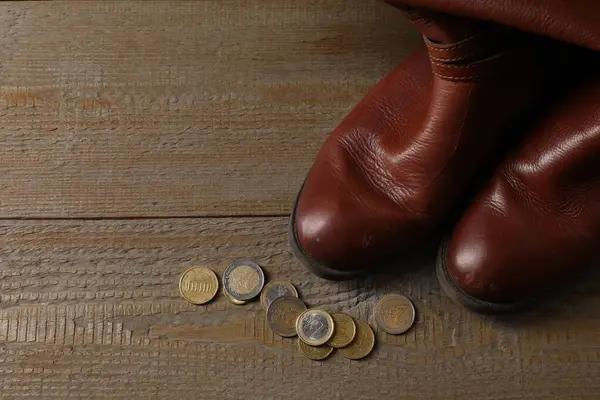 Poverty Old Boots Coins Wooden Table Top View Space Text Stock Picture