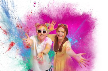Holi festival celebration. Happy women covered with colorful powder dyes on white background clipart