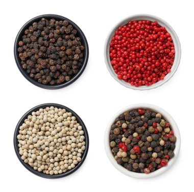 Aromatik baharatlar. Farklı biber türleri beyaz kaselerde izole, üst görünüm