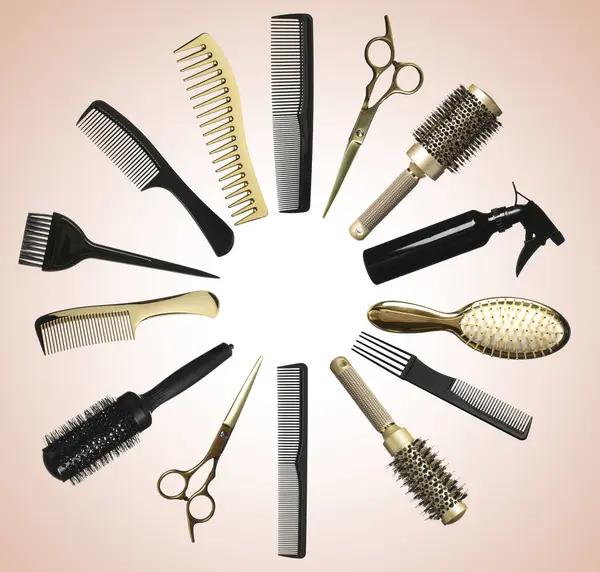 Different hairdresser tools on beige background, set