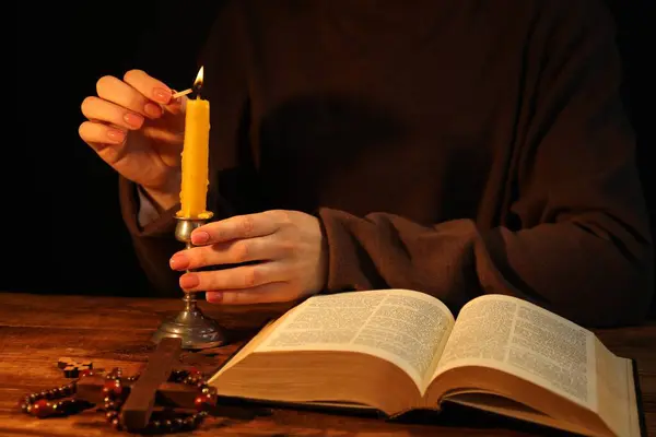 Woman Lighting Candle Table Bible Closeup — Stock Photo, Image