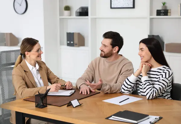 stock image Couple having meeting with lawyer in office