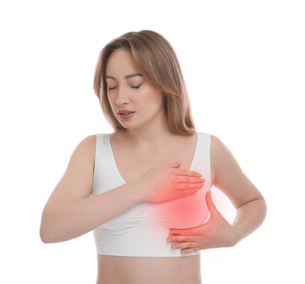 Young woman suffering from breast pain on white background