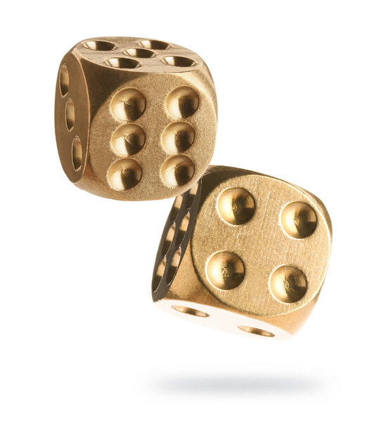 Golden dice in air on white background