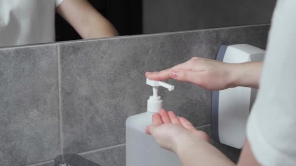 Woman Using Antiseptic Indoors Closeup Plastic Container Pump Dispenser Antimicrobial — Stock Video
