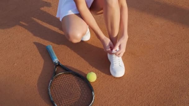 Woman Stylish Sportswear Tying Shoelaces Tennis Court Closeup Camera Moving — Stock Video