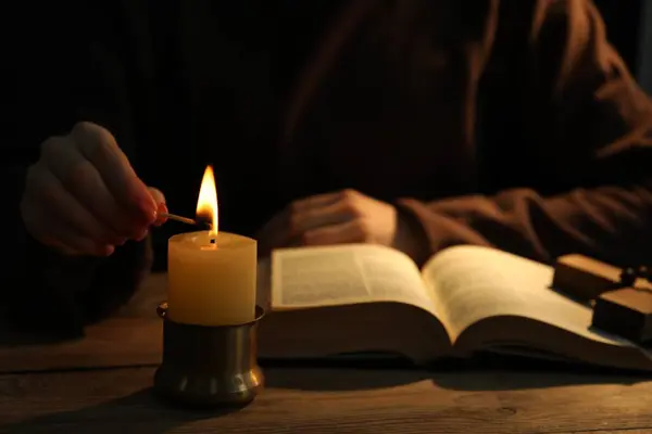 Woman Praying Table Burning Candle Bible Closeup — Stock Photo, Image