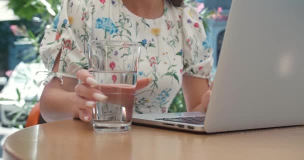 Woman Using Laptop Drinking Water Table Outdoors Closeup — Stock Video