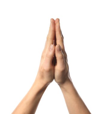 Din. Beyaz arka planda dua eden Hristiyan kadın, yakın plan