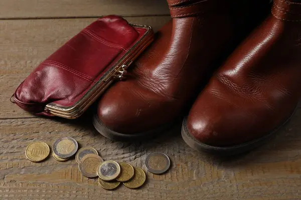 Poverty Old Boots Wallet Coins Wooden Table Royalty Free Stock Images