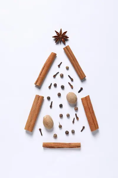 stock image Christmas tree made of different spices on white table, flat lay