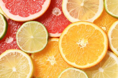 Arka plan olarak farklı dilimlenmiş turunçgiller, üst görünüm