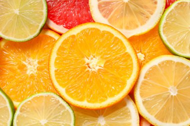 Arka plan olarak farklı dilimlenmiş turunçgiller, üst görünüm