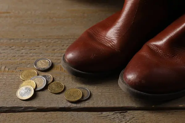 Poverty Old Boots Coins Wooden Table Closeup Stock Image