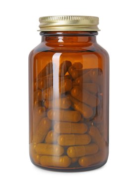 Vitamin hapları beyaz şişede izole edilmiş.