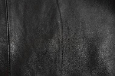 Arka plan olarak siyah deri dokusu, üst görünüm