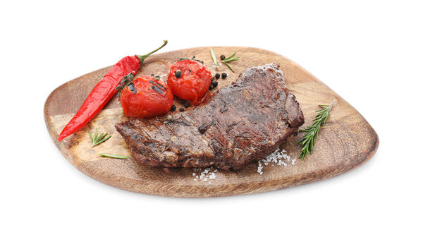 Delicious roasted beef meat, vegetables and spices isolated on white