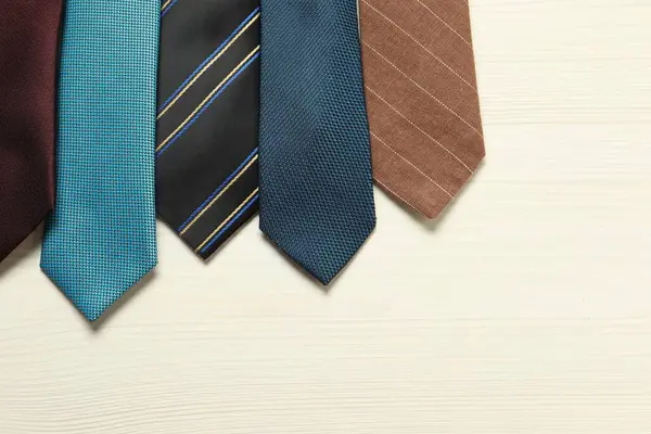 Different Neckties White Wooden Table Flat Lay Space Text — Stock Photo, Image