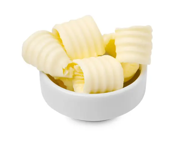 stock image Tasty butter curls in bowl isolated on white