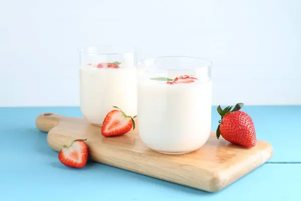 Tasty Yogurt Glasses Strawberries Light Blue Wooden Table — Stock Photo, Image