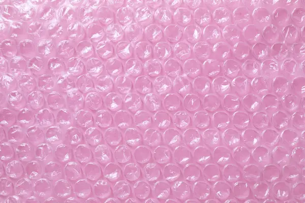 Transparent Bubble Wrap Pink Background Top View — Stock Photo, Image