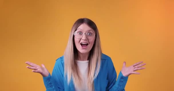 Happy Young Woman Eyeglasses Yellow Background — Stock Video