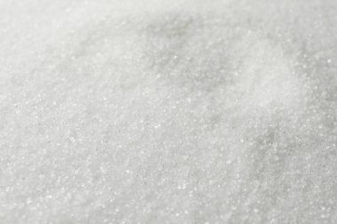 Arkaplan olarak beyaz granüle şeker, yakın görünüm